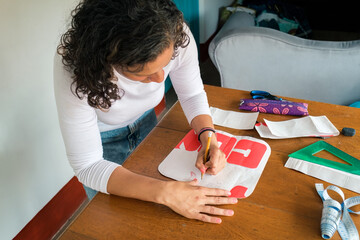 Designer placing annotations on a paper mold