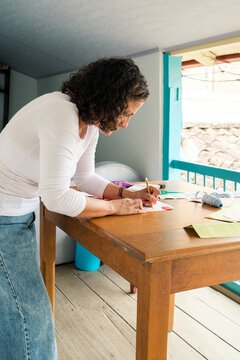 Latina woman designer working at home
