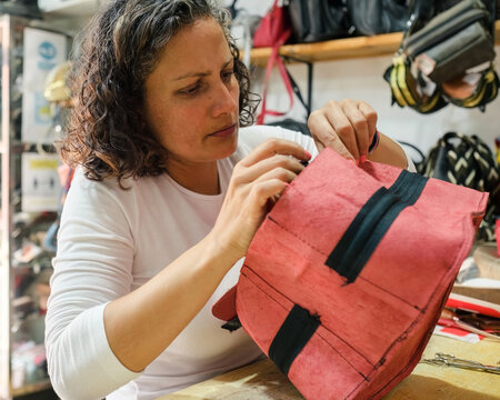 Close-up of Latina woman working leather