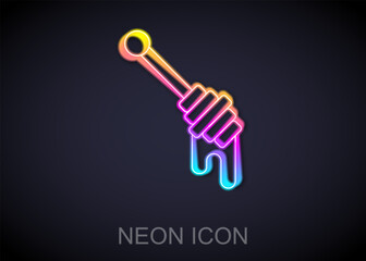 Glowing neon line Honey dipper stick icon isolated on black background. Honey ladle. Vector