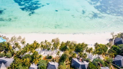 Photo sur Plexiglas Plage de Nungwi, Tanzanie The aerial view of the Zanzibar Island coast is a sight to behold, with its pristine beaches and turquoise waters.
