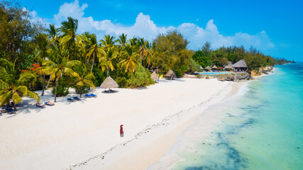 The beach on the Zanzibar Island coast is stunning, with crystal-clear waters and soft, golden sand.