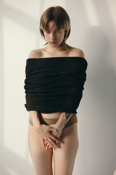 Shy woman portrait white background