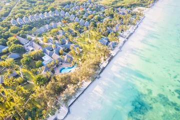 Papier Peint photo Plage de Nungwi, Tanzanie The aerial view of the Zanzibar Island coast is a sight to behold, with its pristine beaches and turquoise waters.