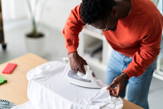 Neat Man Ironing White T Shirt