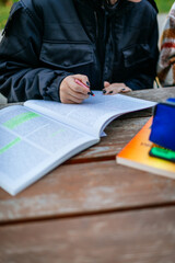 A female hipster high school student studying