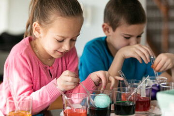 Children Coloring Easter Eggs At Home