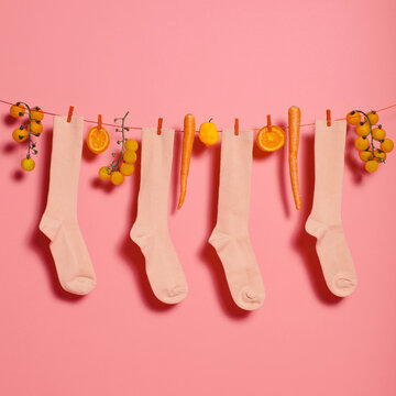 Socks on washing line with vegetables