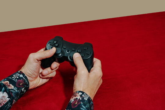 man is using a wireless game controller