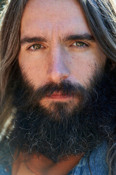Portrait of man with long hair
