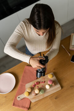 woman taking photos of food