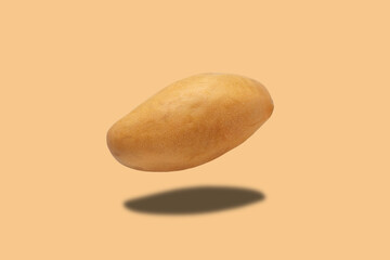 yellow avocado with a shadow on a light background