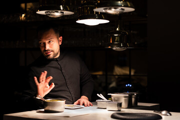 Chef preparing dished in the restaurant counter top