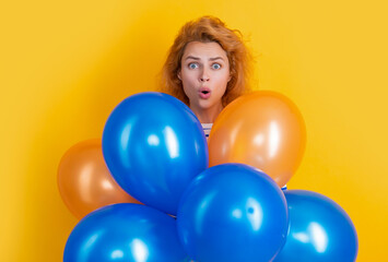 Fototapeta na wymiar happy birthday girl hold balloons in studio. shocked girl with balloon for birthday party