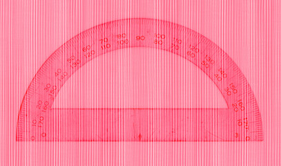 Red protractor with white pencil lines