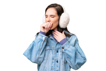 Young caucasian woman wearing winter muffs over isolated background is suffering with cough and feeling bad