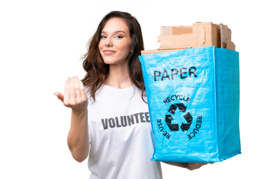 Young caucasian woman holding a recycling bag full of paper to recycle over isolated background inviting to come with hand. Happy that you came