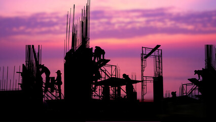 silhouette worker work late in construction site against beauty sky  nature background