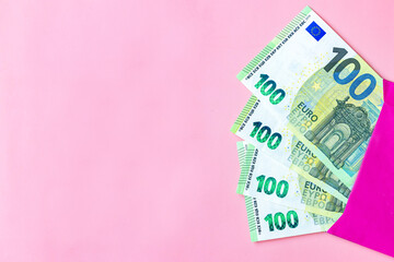 EURO money banknote arranged in pink envelope on soft pink background. EURO money banknote isolated in pink envelopes on soft pink background. Exchange money, Money, Cash, finances,Travel concept.