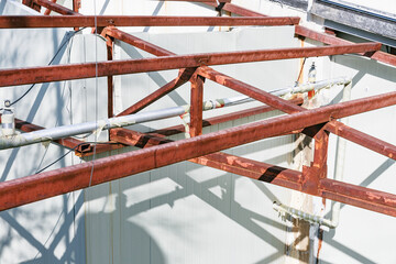 Rusty steel structure of an abandoned warehouse building.