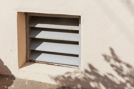 Vents and shadows on building walls.