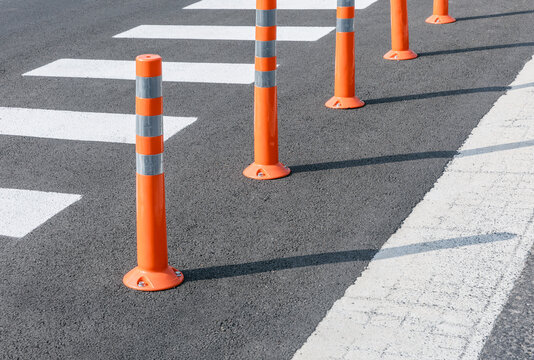 Orange barricades installed on the road.