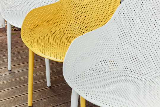 White and yellow outdoor chairs.