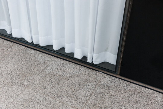 Show window and white curtains.