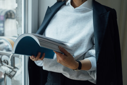 Cropped Image of Woman Reading Book