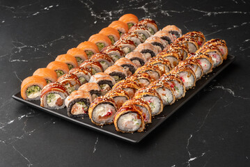 Japanese rolls with fish, vegetables and cottage cheese. Big set of sushi rolls