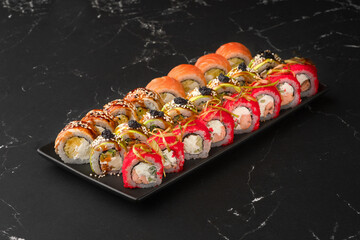 Japanese rolls with fish, vegetables and cottage cheese. Big set of sushi rolls