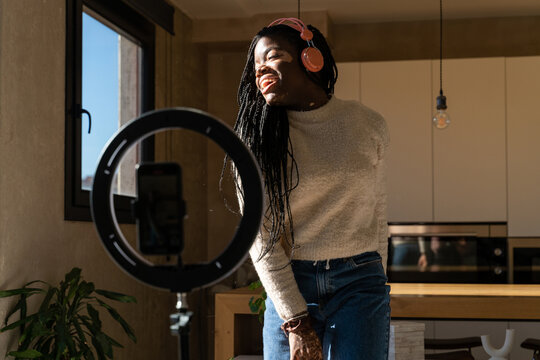 Woman dancing and recording videos for tik tok