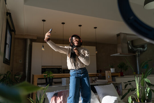 Woman dancing and recording videos for tik tok