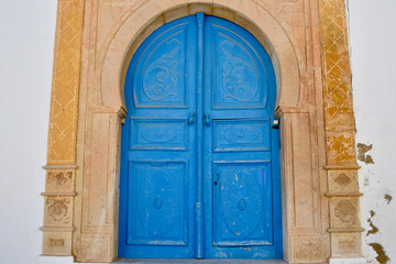 Vintage Tunisian Blue Keyhole Door and Pink Marble Frame in Sidi Bou Said, Tunis