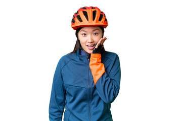 Young cyclist woman over isolated chroma key background with surprise and shocked facial expression