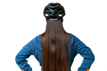 Young cyclist woman over isolated chroma key background in back position