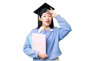 Young student woman over isolated chroma key background doing surprise gesture while looking to the side