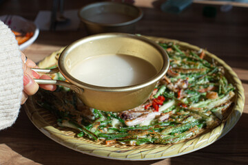 Korean seafood pancake Jeon with makgeolli