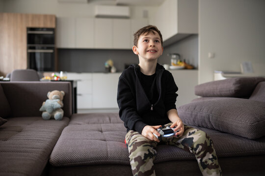 Kid Holding Video Games Controller Indoors