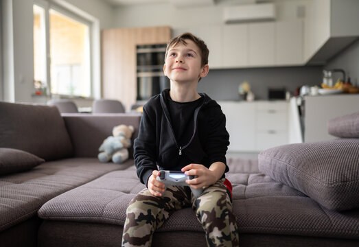 Child Holding Video Games Controller Indoors