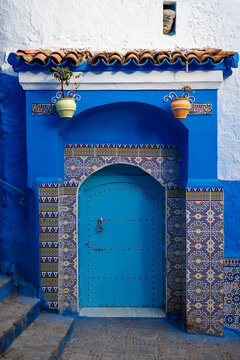 A blue-decorated door in a house