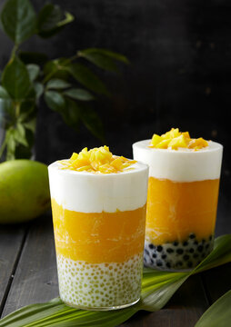 Homemade delicious drink, mango smoothie pearl milk cap