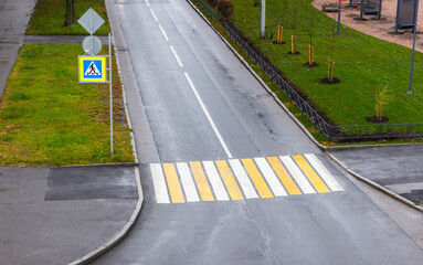 Pedestrian crossing. Yellow white road marking zebra