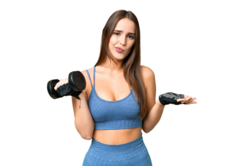 Young sport woman making weightlifting over isolated chroma key background making doubts gesture while lifting the shoulders