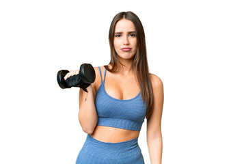 Young sport woman making weightlifting over isolated chroma key background with sad expression