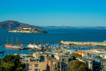 Cityscape at fisherman's worf in downtown coastal san francisco california with alcatraz island in...