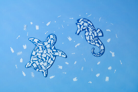 Plastic waste ocean environment problem concept paper cut.