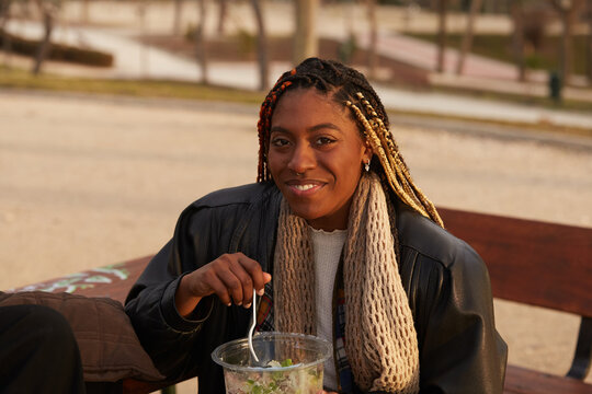 Woman eating pre made salad