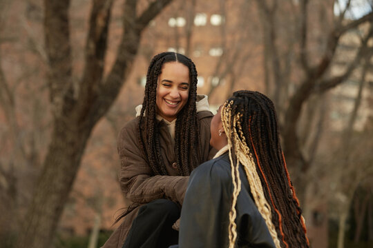 Female friends smiling and enjoying the outdoors