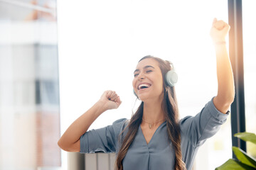 Business woman, headphones and dance in office for happiness, motivation and fun celebration of...